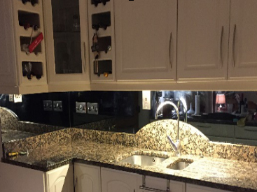 Grey Mirror splashback with socket cut outs